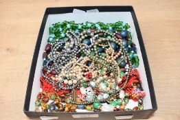 A small assortment of costume jewellery, including faux pearl necklaces and other beaded pieces