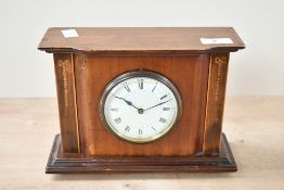 An Edwardian mahogany cased mantel clock, having decorative inlaid fruitwood swags, with a French