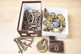 A large selection of 19th to early 20th-century brass and iron keys and locks, to feature a