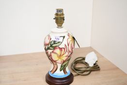 A small 20th-century Moorcroft Pottery 'Frangipani' table lamp base, having colourful tube-lined