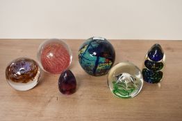 A quantity of 20th-century studio glass paperweights, to include a Wedgwood round purple and brown