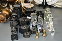 A large selection of late 19th to early 20th-century metal weights, to feature a graduated set of