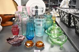 A selection of late 19th to 20th-century glass ware, to feature a green Art Deco-style three-