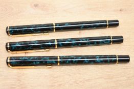 Two Parker Rialto converter fill fountain pens and a rollerball pen in Laque Aqua