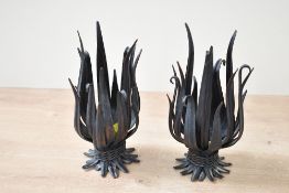 Two unusual late 20th-century metal Folk Art-style wheat candle holders, featuring stylised metal