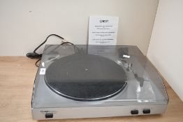 A modern ION TTUSB05 USB turntable, designed for playing vinyl records and converting them into