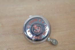 A vintage J. Adie and Nephew Limited chrome-plated 'Flying Scot' bicycle bell, featuring the