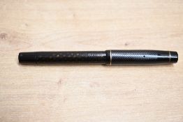 A De La Rue Onoto 5601 plunger fill fountain pen in Black with a translucent barrel single cap