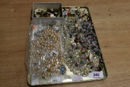 An assortment of costume jewellery, including a semi-precious chips necklace, faux pearls and