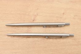 Two Parker 75 ballpoint pens in Flighter having chrome trim (one advertising)