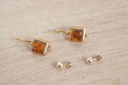 A pair of amber set yellow metal drop costume earrings and a pair of gold filled ball studs