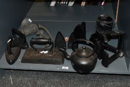 A selection of antique cast iron 'kitchenalia' and similar items, to include a rectangular handled