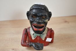 A large early 20th-century painted cast iron 'Jolly Gent' mechanical money bank