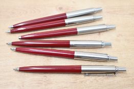 Six Parker Jotter ballpoint pens in burgundy