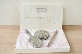A mid to late 20th-century Anais Anais Cacheral silver-plated vanity dressing table set, featuring
