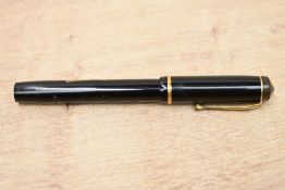 A Conway Stewart Dinkie No540 lever fill fountain pen in Black with single cap band having Conway