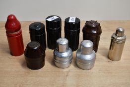 Nine Ink bottle holders, Five Bakelite including Swan Ink, Waterman and Onoto. Three alloy for