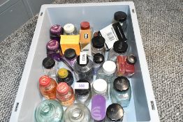 A collection of empty ink bottles