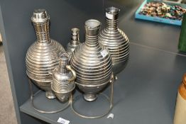 An early 20th-century Italian Calegaro Art Deco silver-plated decanter and wine flask set, of “