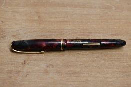 A Burnham No55 lever fill fountain pen in Red, Grey and Gold with two narrow cap bands Burnham