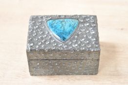 A 20th-century Arts and Crafts Archibald Knox-style pewter clad box, having a dimpled pewter