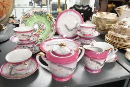 Thought to be early to mid 20th-century Japanese Moriage dragonware part tea tea set, having a