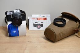 A Pentax ME Super camera with a Tokina 28-70mm 1:3,5-4,5 lens in a Billingham soft case