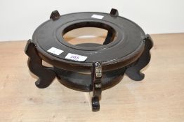 A 20th-century hard wood Oriental-style vase pedestal, unmarked, 23cm diameter and 10cm in height,