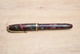 A Conway Stewart Dinkie 550 lever fill fountain pen in Marbled Plum with Black veins with one cap