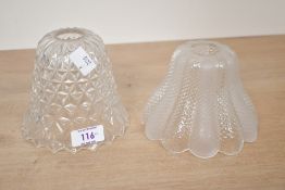 Two small early to mid 20th-century glass light shades, to feature a pressed cut glass example