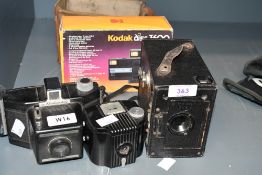 A Ensign 21/4B box camera, a bakelite Kodak Baby Brownie (as found), a Coronet Flashmaster and a