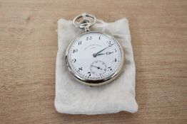 A white base metal top wound open face pocket watch, the white dial having Arabic numerals marked