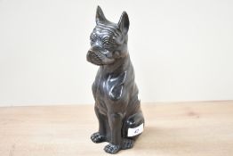 A sweet 20th-century decorative cast and patinated metal boxer dog, of seated form with a peaceful