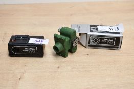 Two miniature cameras. A Merlin Spy camera and a boxed Halina Micro 110