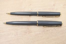A Parker 45 ballpoint pen and propelling pencil in grey