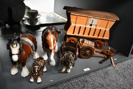 A group of four mid 20th century Melba Ware-style Shire horses and wooden cart figurines featuring
