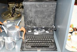An early to mid 20th-century Imperial 'The Good Companion' Model T portable metal typewriter,