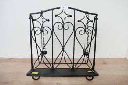 A sweet vintage metal ornate iron book/cooking book stand, featuring Art Nouveau-style scrollwork,
