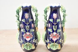 Two early 20th-century Art Nouveau Josef Strnact majolica bud vases, featuring a deep cobalt blue