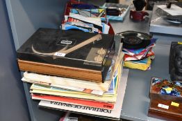 A late 20th-century Mettoy Musicmaker Solid State record player, accompanied by a collection of 7-