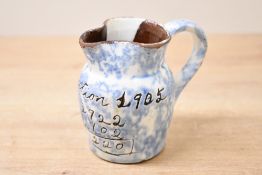 Local Interest* An interesting early 20th century mottled slip glazed Wetheriggs pottery jug,