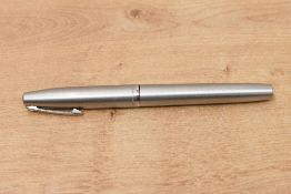 A Sheaffer 444 cartridge/ converter fountain pen in brushed steel with short clip and white spot