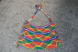 Of ethnographic interest, a contemporary Papua New Guinea natural fibre multi-coloured Bilum, a