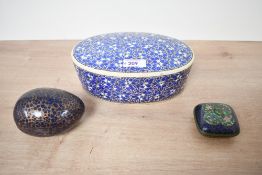 Two early 20th-century Indian-style papier-mâché boxes, including an egg-shaped example with