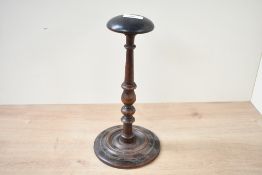 Thought to be 19th-century treen yew wood wig stand, featuring a smooth domed top, finely turned