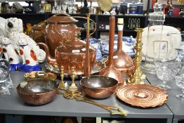 A selection of mixed copper and brass wares, to include a large copper kettle of traditional form, a