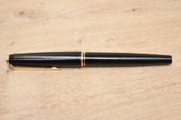 A Montblanc 221 cartridge/ convertor fill fountain pen in black having broad gold nib