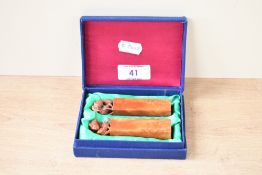 A pair of 20th-century Chinese hard stone seal chop, featuring a hand carved goat and kid figure