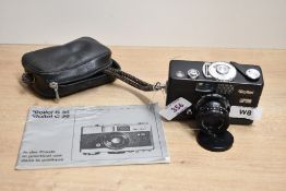 A Rollei B35 camera with Trioter 3,5/40 lens in zip cover and Booklet