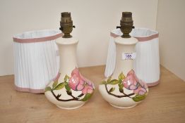 Two 20th-century Moorcroft 'Magnolia' table lamp bases, having soft pink tube-lined floral